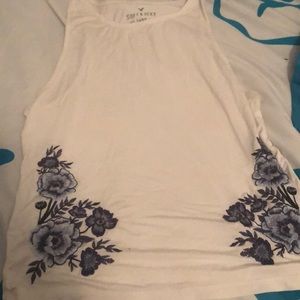 Embroidered white tank top with blue flowers